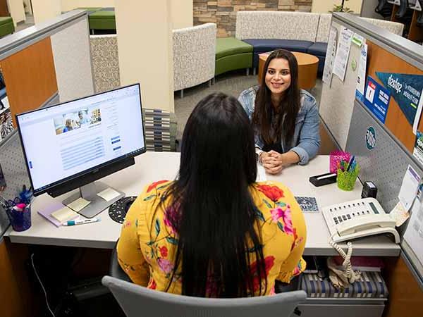 student working with a financial aid counselor in argo central